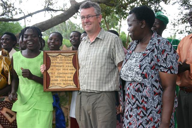 Chairman receiving plaque
